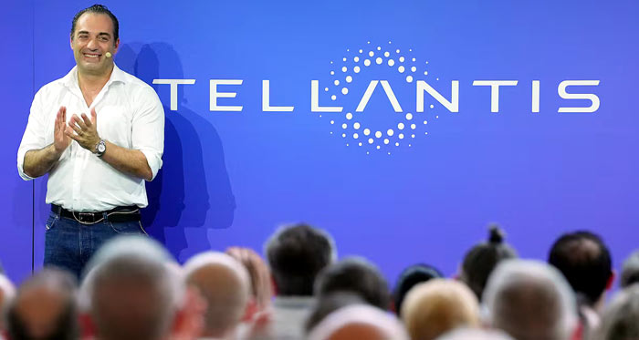 Antonio Filosa and Stellantis logo
